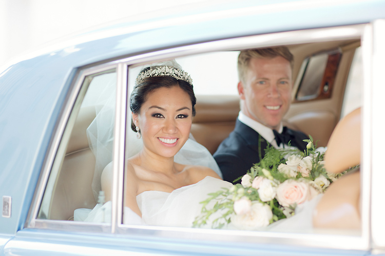 Bridal couple in car